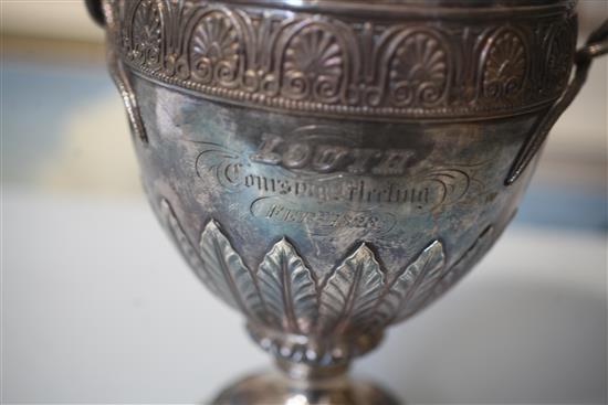 A George IV silver two handled presentation pedestal trophy cup and cover by Benjamin Smith III, 72.5 oz.